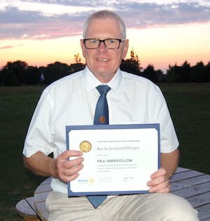 Kevin Winzer with his Paul Harris Fellowship award